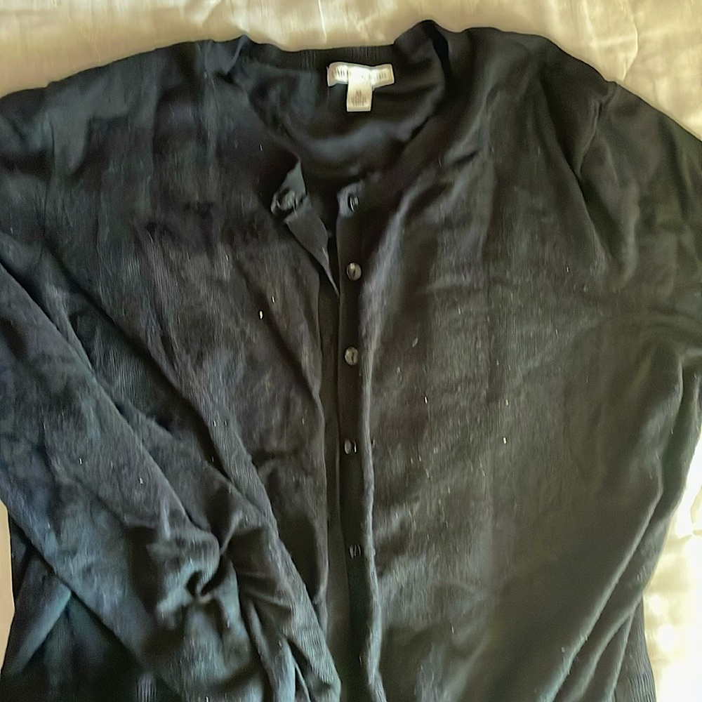 This warm, short cardigan is perfect for the fall, with its classic black color.